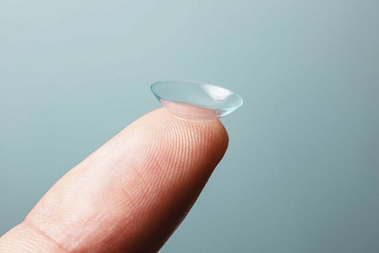 when were coloured contact lenses invented
