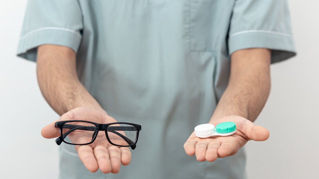 Glasses and lens in both hands